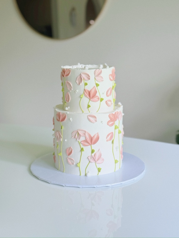 Wedding cake with floral accents by Shaddai